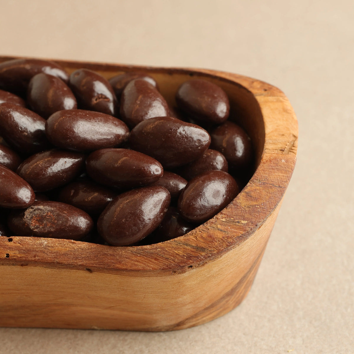 Whole almonds covered in milk chocolate