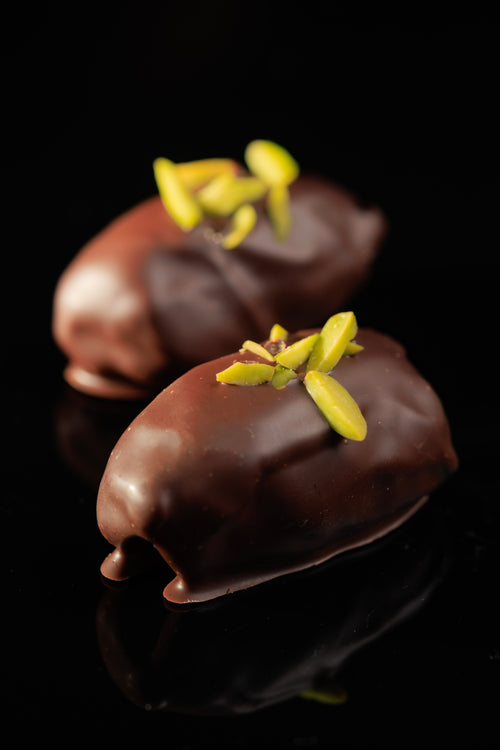 Khudri Date with Pistachio Coated in Dark Belgian Chocolate