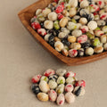 Wasabi flavored green peas in assorted colors with a crunchy coating Noix Noix